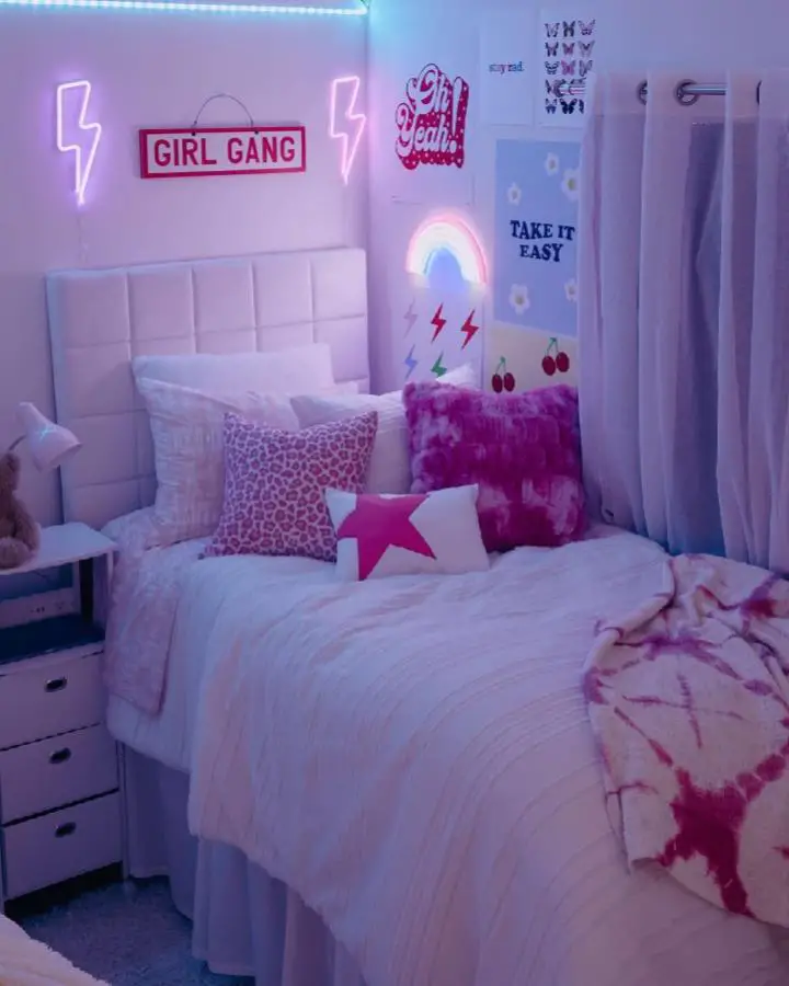 Vibrant pink neon lightning bolts and signs from @dormify. Perfect millennium-inspired bedroom setup with electric atmosphere.