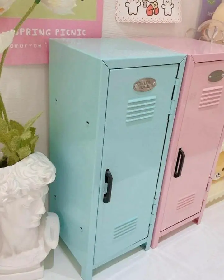 Mint green and pink mini metal lockers from The Other Aesthetic with authentic school-style ventilation slats and handles.