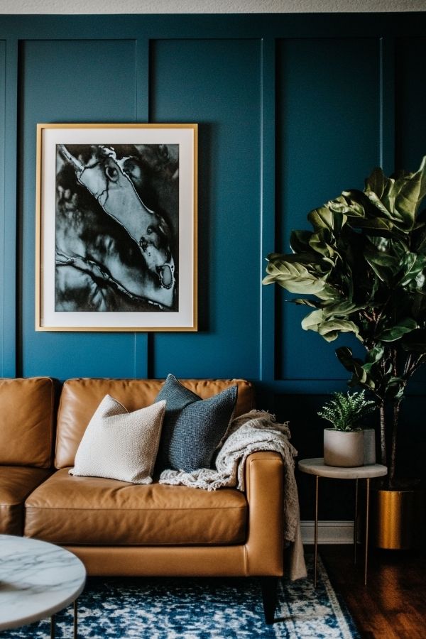 Above the couch decor ideas: Modern abstract paintings with bold colors.