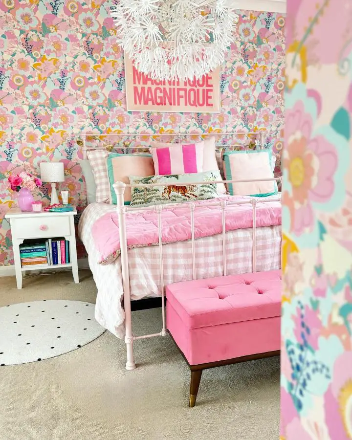 Maximalist floral bedroom wallpaper ideas from @colourpopathome featuring coral pink mint green blooms with white metal bed frame.