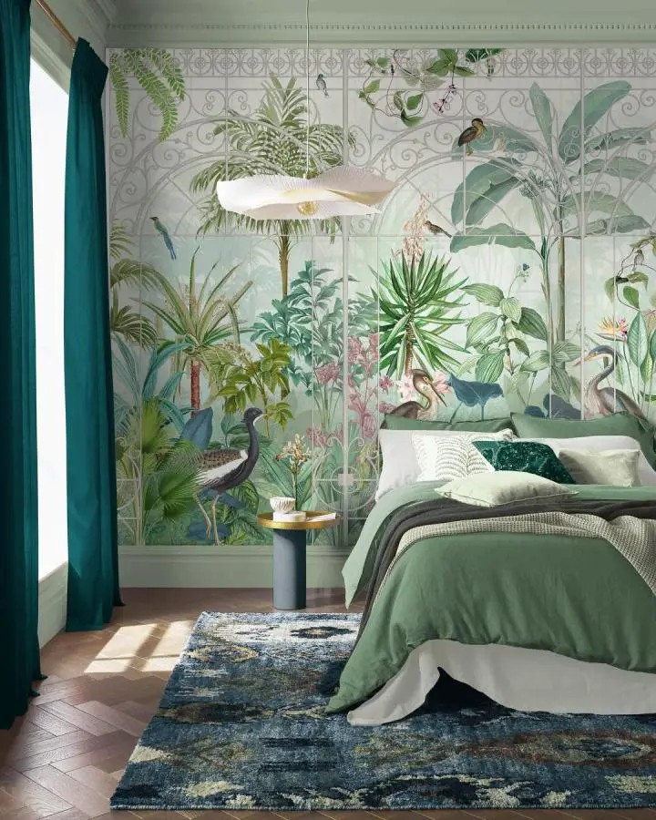 Lush tropical botanical mural bedroom wallpaper ideas from @grahamandbrown featuring exotic birds and oversized palm leaves.