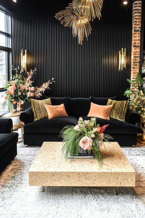 Elegant black & gold living room ideas: velvet furniture, golden lighting.