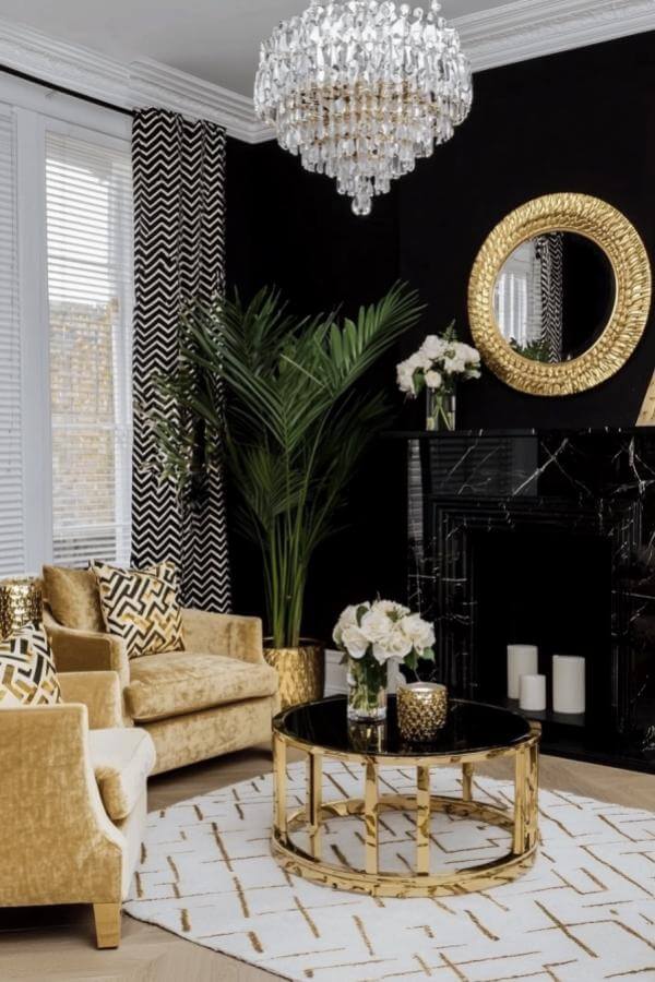 Golden velvet elegance transcends expectations in luxurious black & gold living room ideas.