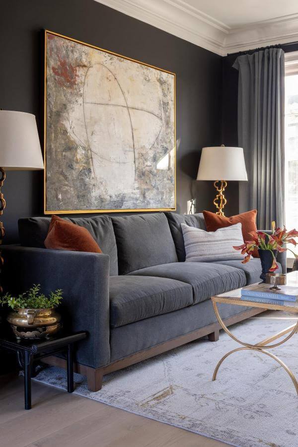 Artful symmetry blends with charcoal elegance in black & gold living room ideas.