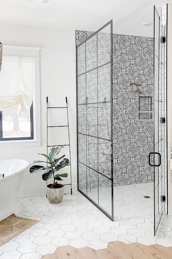 Boho bathroom ideas: Intricate patterned shower tiles, rustic decor elements.