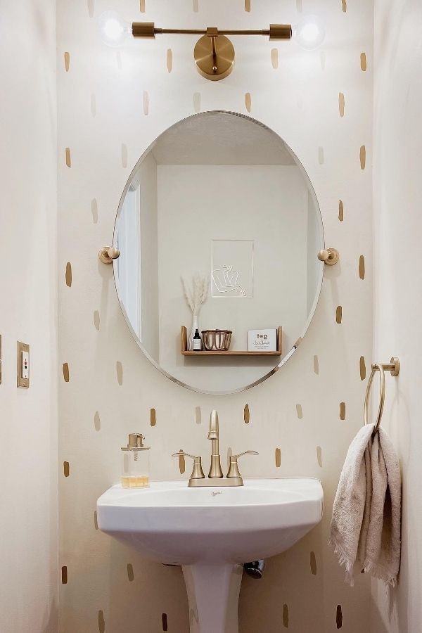 Colorful boho bathroom with whimsical polka dot wall; boho bathroom ideas.