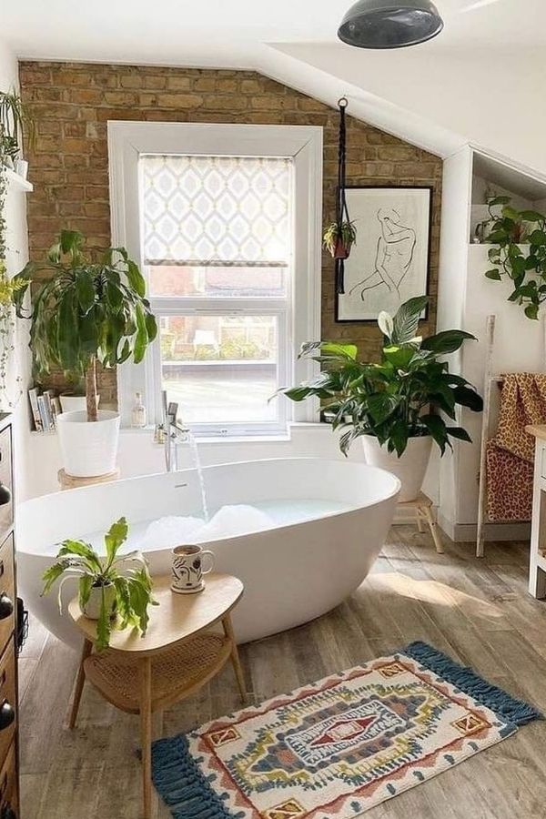 Freestanding bathtub in boho bathroom, emphasizing boho bathroom ideas.