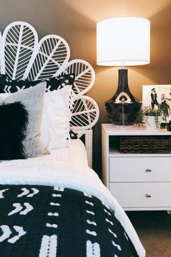 Whimsical feathered headboard from @lennarwestinteriordesign adds charm to a playful boho teenage girl bedroom setting.