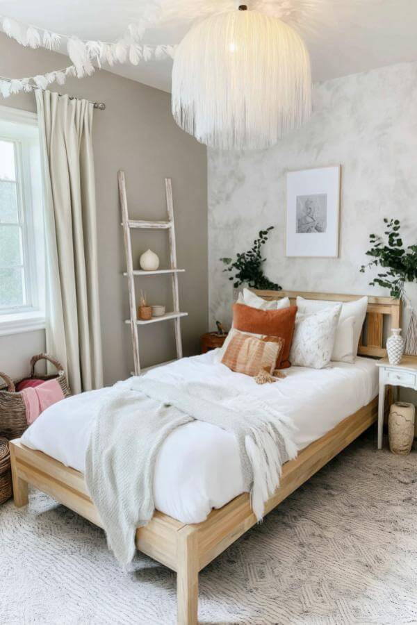 Whimsical tassel wall decor from a boho teenage girl bedroom with dreamy, chic vibes and cozy, eclectic charm.