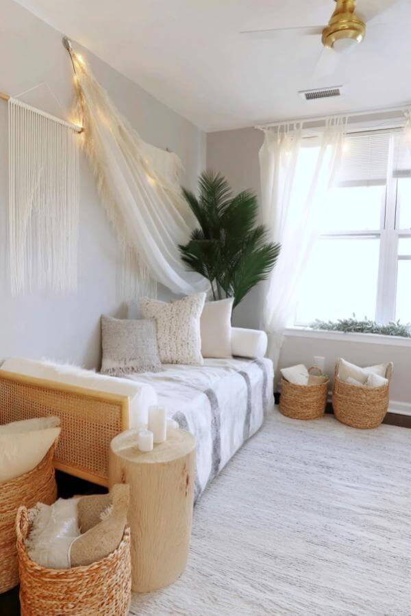 Dreamy canopy draping over a cozy bed from a serene sanctuary with a boho chic vibe.