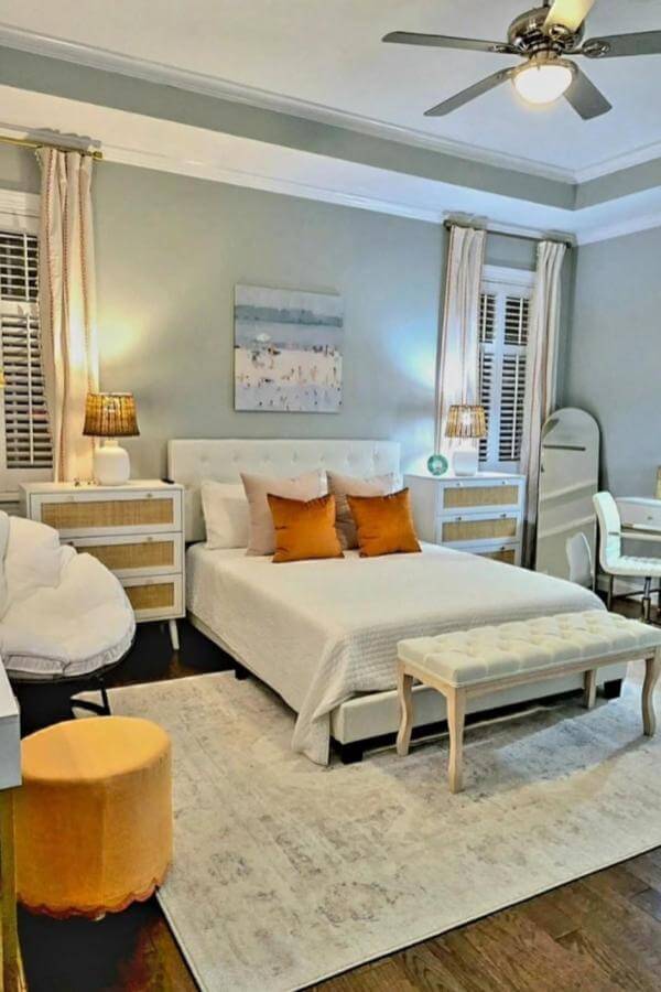 Radiant orange accents on cozy cushions from @alizwelch create a warm and inviting boho vibe.