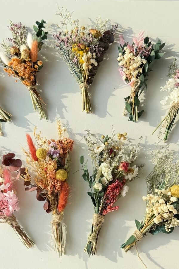 A vibrant display of colorful, dried flowers in artistic arrangements.