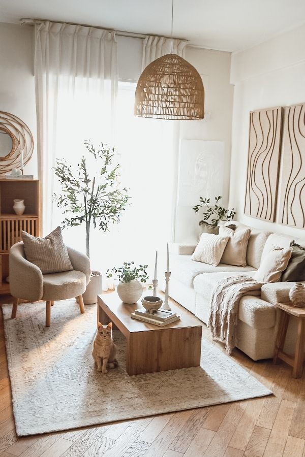 Warm, inviting boho living room with plants, textured fabrics, eclectic decor.