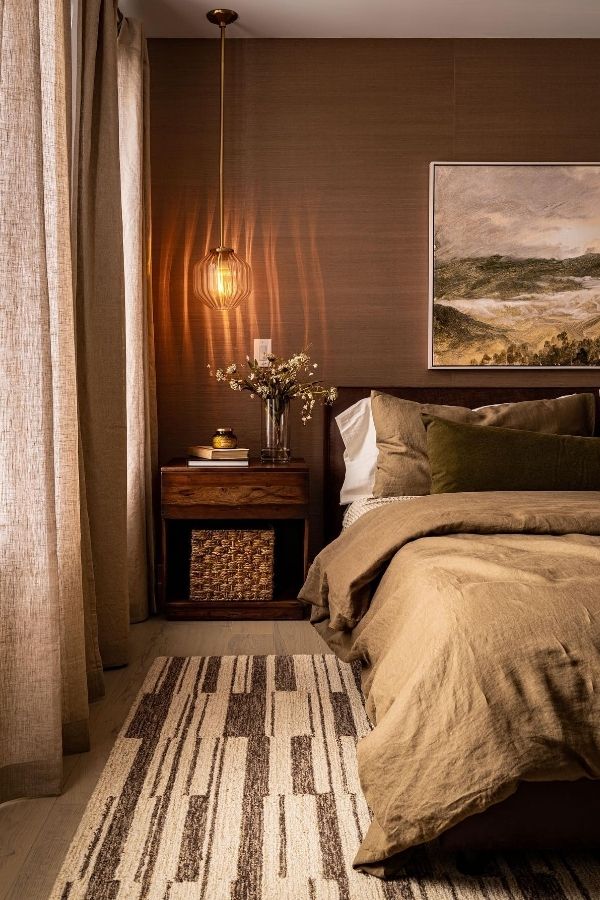 Cozy bedroom featuring warm earthy tones with soft, inviting decor.