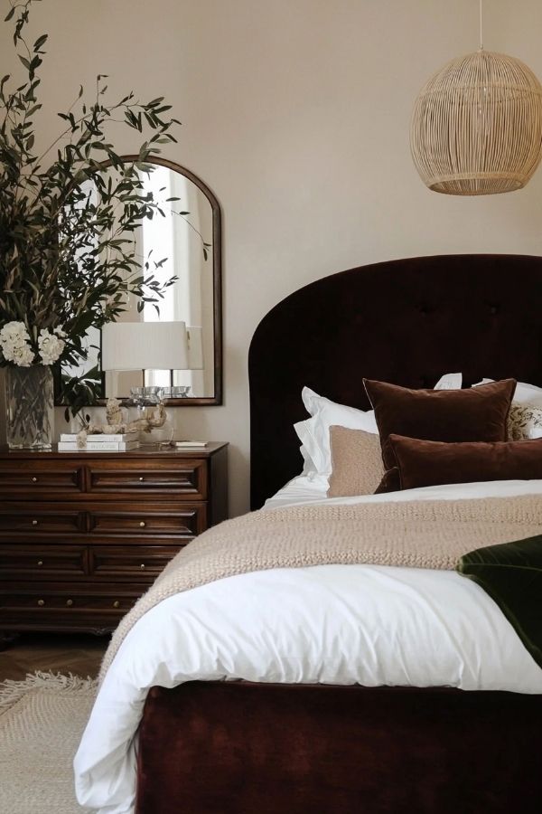 Serene bedroom featuring neutral tones, luxurious bedding, and tasteful decor.