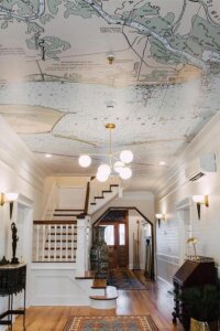Vintage nautical ceiling from @nauticalchartwallpaper. Transforms the space with sea-inspired elegance.