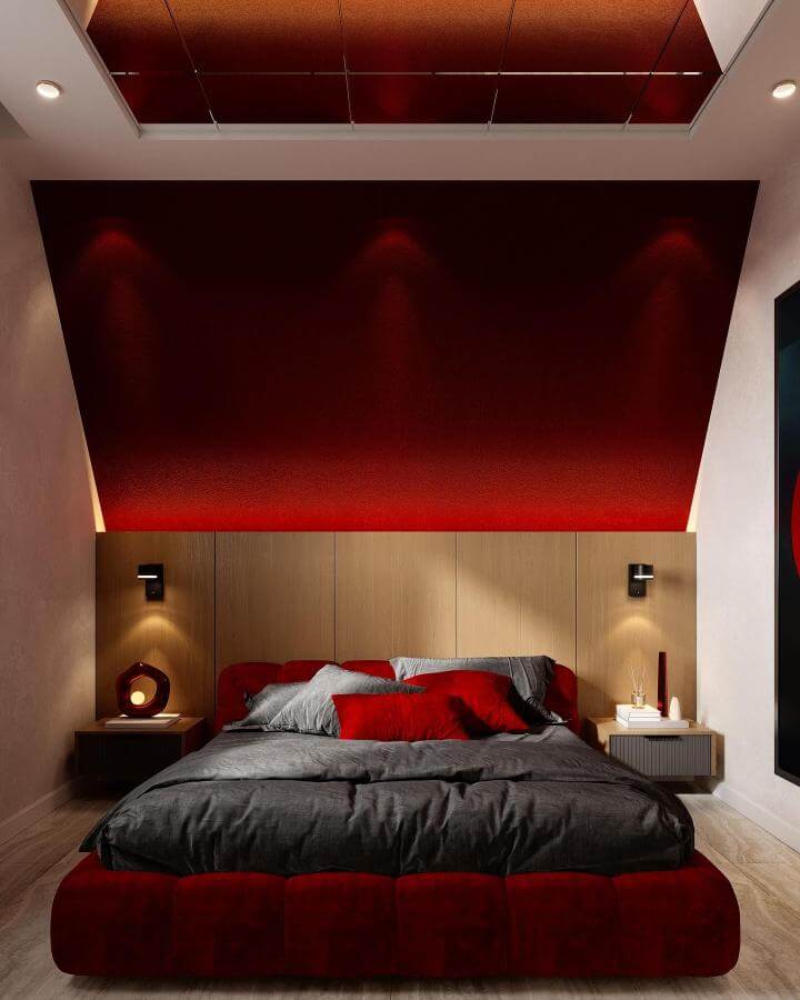 Velvet cherry red bed with wood panel backdrop and soft lighting from @portalgroup.az. Cozy and stylish warm bedroom setup.