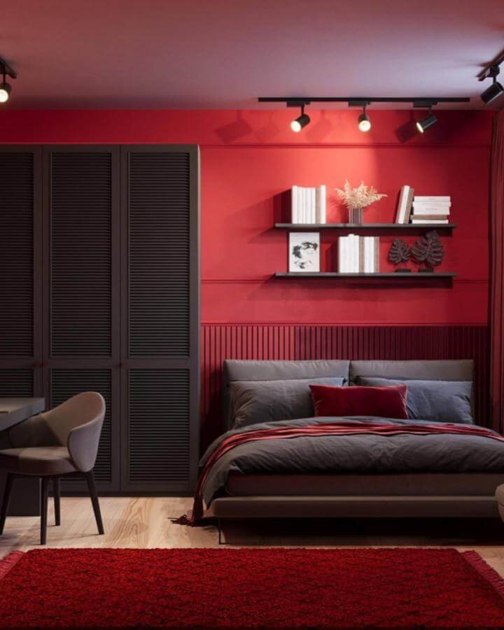 Cherry red textured wall with black shelving and gray bedding in a modern cozy bedroom by @tet_sydorenko_visual360.