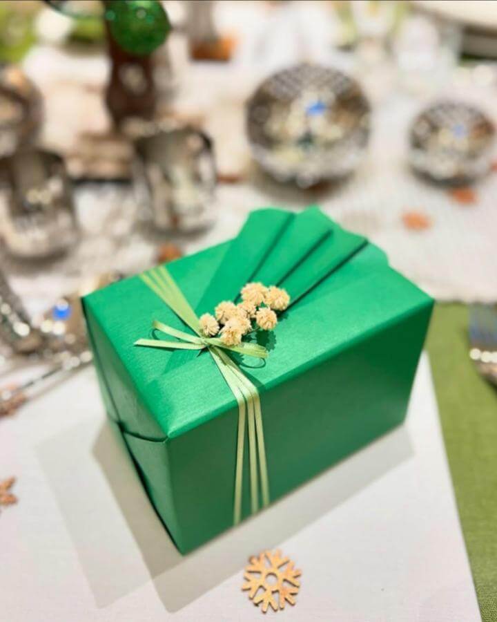 Emerald wrapped gift christmas crafts for adults from @janemeans. Layered pale ribbon with dried flower cluster.