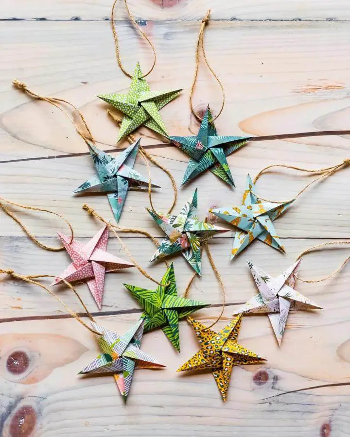 Patterned origami star ornaments from FoldyMcFolderson featuring botanical and geometric prints with twine hangers