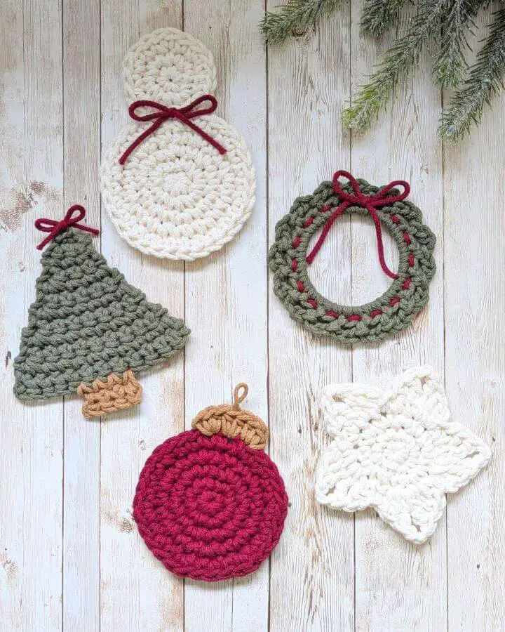 Chunky crochet ornament collection from @floralfeatherdesign featuring snowman, wreath, tree, ball, and snowflake designs in festive colors