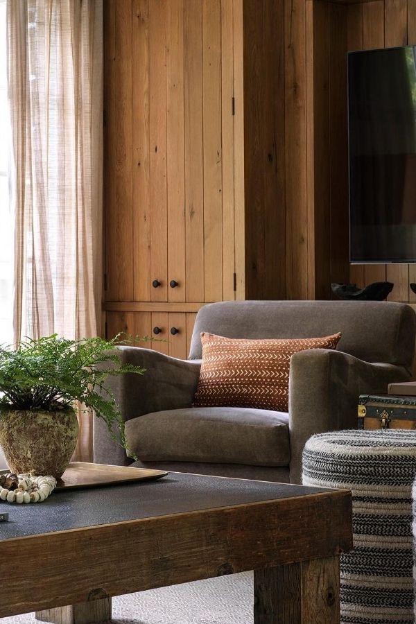 Colonial living room featuring vintage furniture and sleek modern accents.