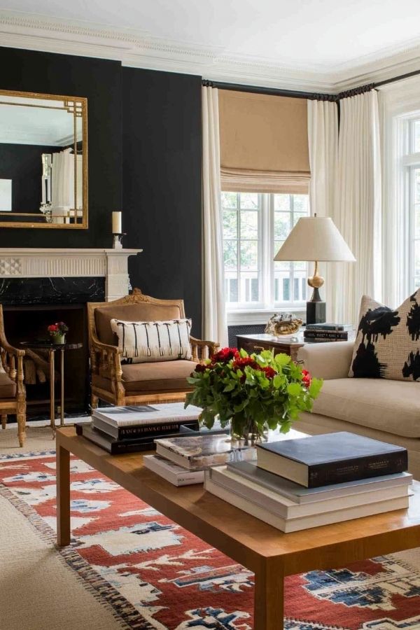 Classic colonial living room featuring dark walls and elegant furnishings.