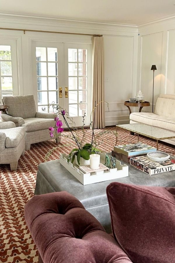 Cozy colonial living room featuring bright colors and framed artwork.