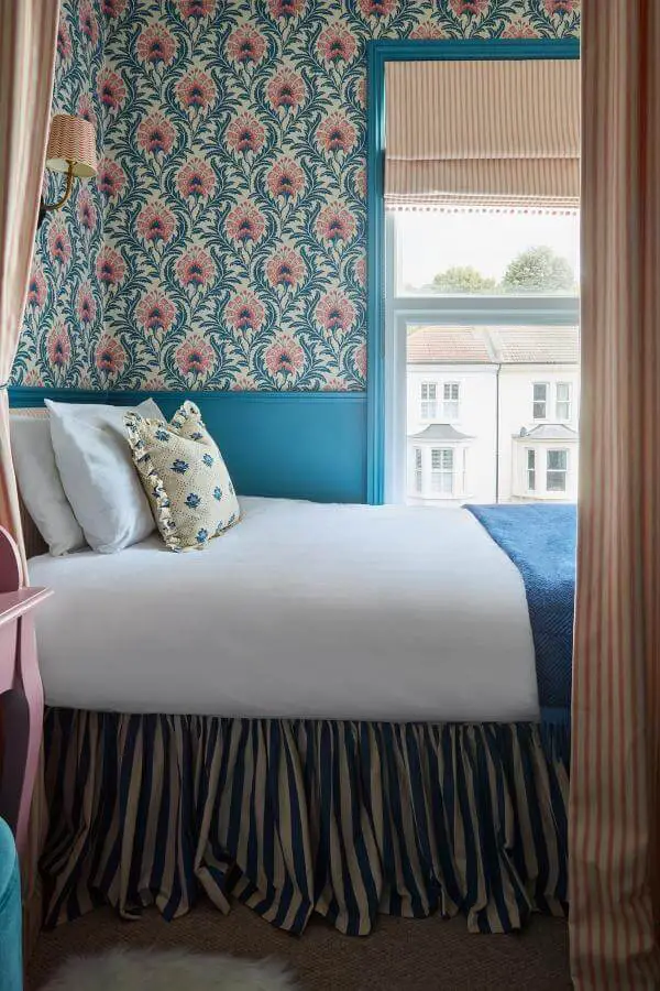 Vibrant patterned wallpaper walls from @uns.hobbs_interiors. Playful textures inspire a whimsical cozy space.