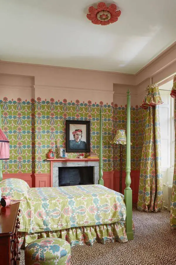 bold floral patterns on walls and fabrics from @stylingyourhome. Vibrant layers enhancing cozy colorful cottagecore interior.