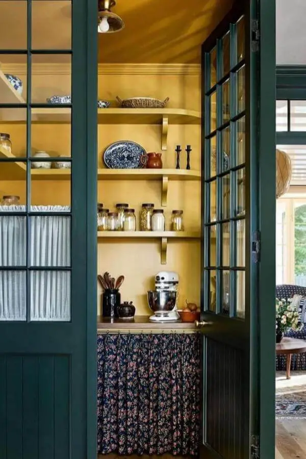 Floral skirted pantry counterfront from @louiseroehome. Charming, cozy space with vintage cottagecore vibes.