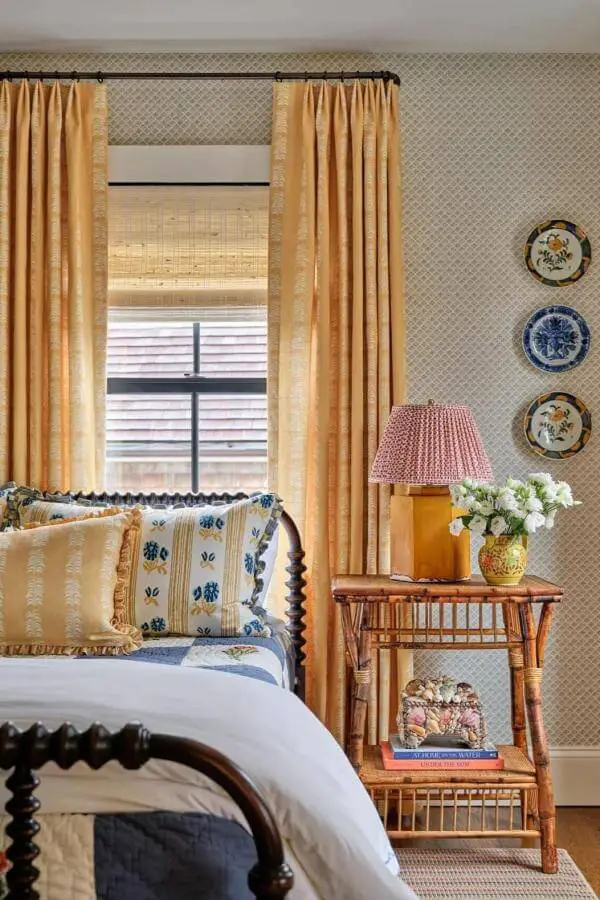 Charming vintage plates brighten this cozy nook with colorful cottagecore interior vibes from @katierosenfeld.