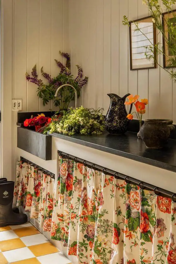 Floral fabric sink skirt charm in full bloom from @archdigest. Perfect for charming rustic bathroom decor.
