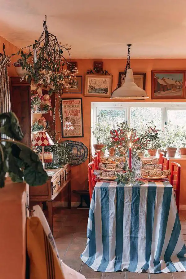 Bright striped tablecloth on dining table from @emma__ainscough. Adds playful whimsy to cottage-inspired space.