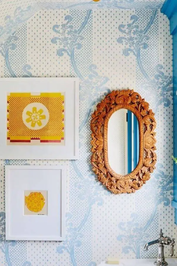 Carved wood mirror from @katierosenfeld adds whimsical vintage flair to colorful cottagecore interior with bright charm.