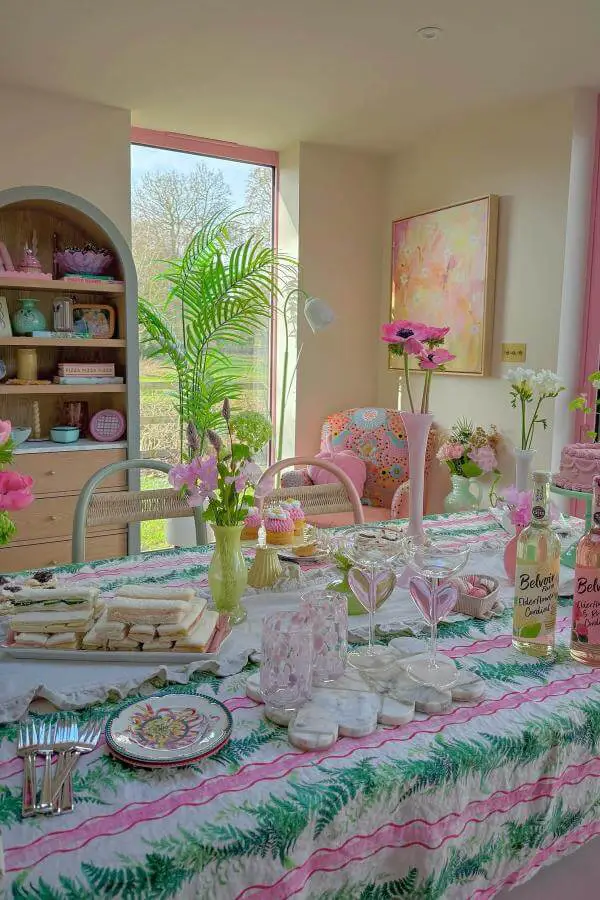 Vibrant floral table setting from @thiscolourfulnest showcasing colorful cottagecore interior with whimsical, cozy charm.