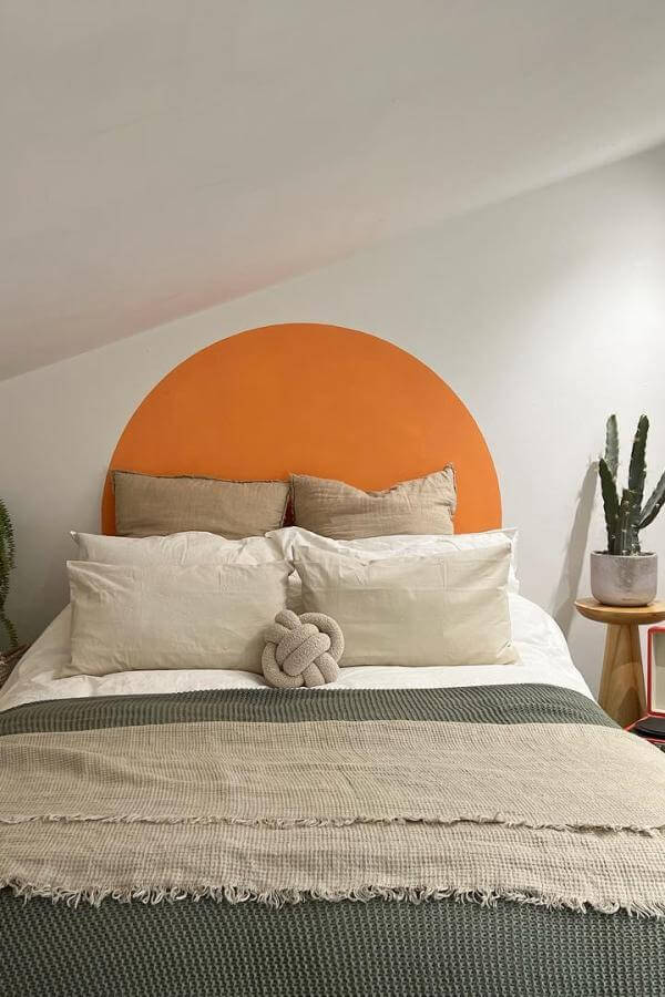 Bold headboard with warm sunset hues from @happyharrishousebuild, a perfect centerpiece for a vibrant teenage bedroom.