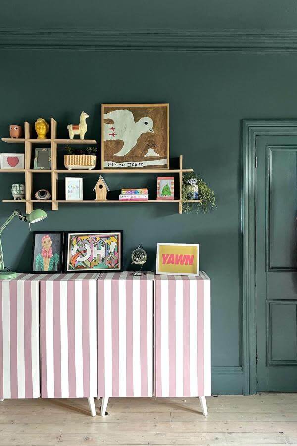 Striped dresser adds whimsy to colorful teenage bedroom from @the_idle_hands, enhancing vibrant and playful decor.