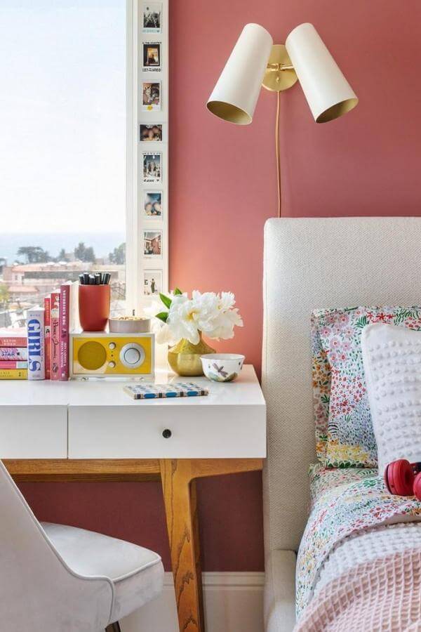 Sleek wall lamp illuminates from @nystrom_design. Elevates cozy vibes in a vibrant, colorful teenage bedroom.