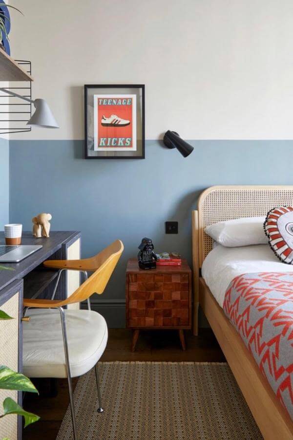 Retro-inspired art adorns vibrant and cozy bedroom walls from @fionadukeinteriors, perfect for a colorful teenage bedroom.