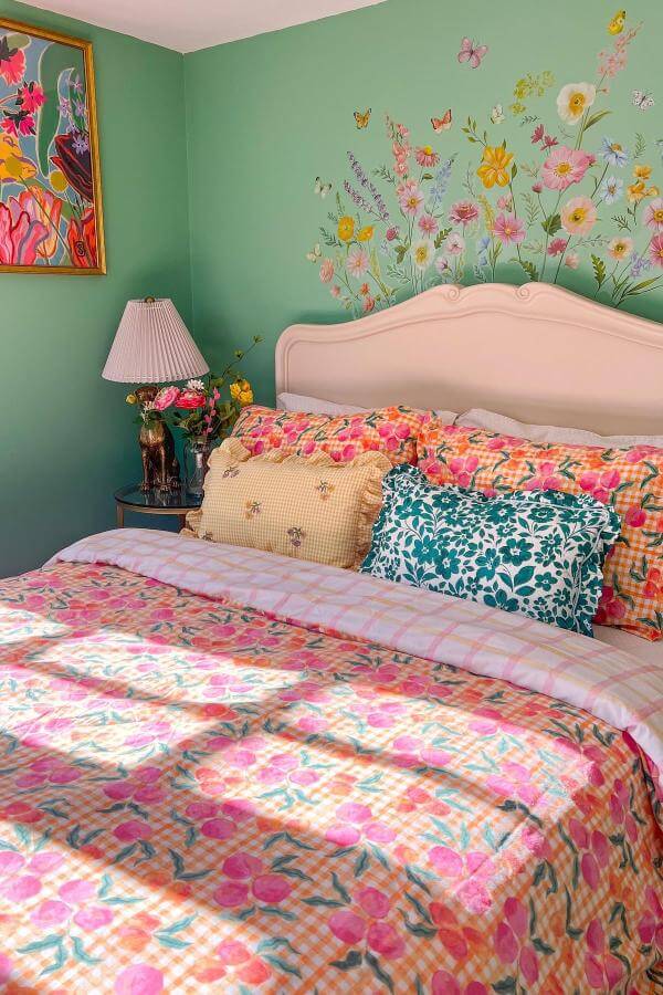 Vibrant whimsical floral murals in cozy bedroom from @louisashome. Soft textures enhance cottagecore aesthetic.