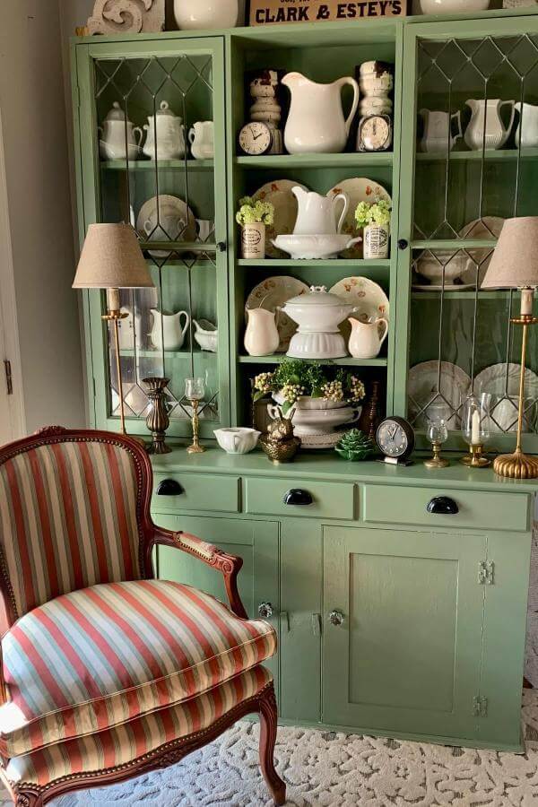 Pastel green wooden hutch from @mypeaceathome showcasing charming vintage ceramics with a cozy cottagecore aesthetic.