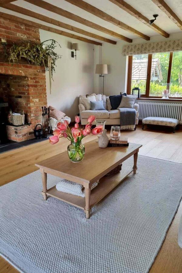 vibrant floral arrangement on rustic wooden table from @lynne_bramble_barn. Fresh blooms enhance the cozy cottagecore aesthetic.