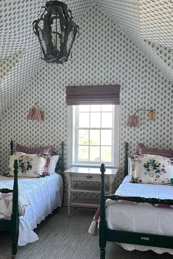 Lush allover botanical wallpaper transforms cozy attic nook from @katierosenfeld. Perfect cottagecore bedroom inspiration.