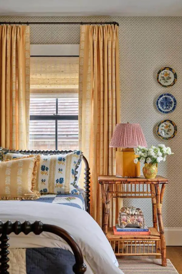 Vintage rattan nightstand from @katierosenfeld. Adds cozy charm to cottagecore bedroom ideas.