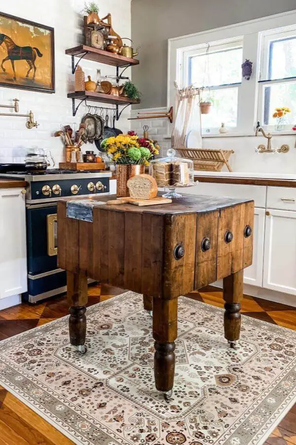 Rustic wooden butcher block island from @grantcottage_1924 showcasing authentic cottagecore kitchen ideas with vintage charm.