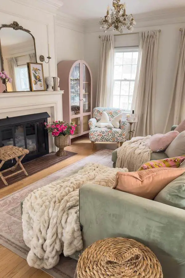 Soft cream chunky knit throw on rustic sofa from @emilywelchstyle. Perfect cozy accent for relaxed spaces.