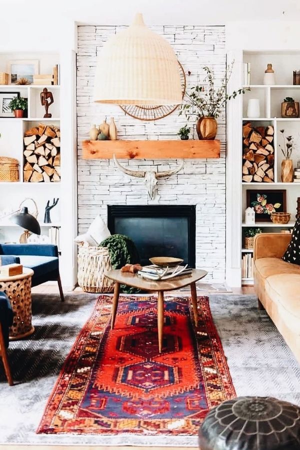 A cozy rustic room with soft pink floral accents throughout.