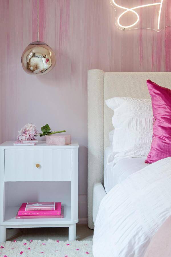 Radiant neon glow illuminates stylish pink bedroom from @shaunnlipseyco, creating a cozy and cute ambiance for relaxation.