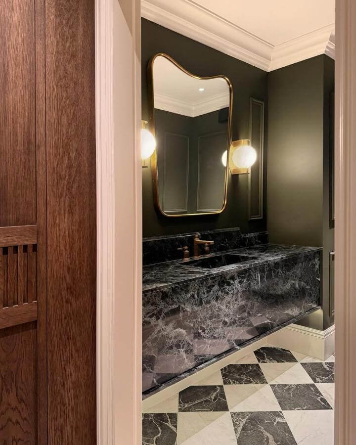 dark green powder room with marble countertop and brass accents by @shaadee_asekour_interiors elegant moody bathroom design